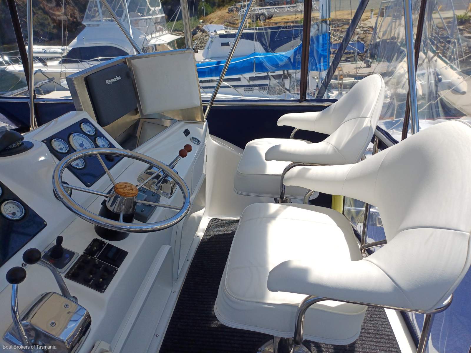Waste Knot Caribbean 35 Flybridge Cruiser with a generator and bowthruster Boat Brokers of Tasmania
