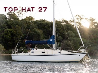 Top Hat 27 ~ With a tender and outboard.