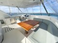 Sunreef Yachts 60 Power:The flybridge dinette is able to sit 6 for daytime cruising and entertaining