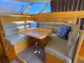 Dyna 48 Flybridge:Starboard lounge coverts to bed