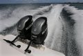 Thomascraft - Saloon opens onto a huge rear deck:Twin 350HP Suzuki outboard with dual counter rotating props