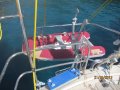Najad Aphrodite 42 Sloop with Trade Wind Rig:Using the electric winches to raise the dinghy.