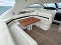 Sunseeker Portofino 53:Cockpit lounge with Flipout Teaked Table