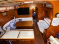 Amel 53 Super Maramu - The Ultimate Global Cruising Yacht:Main saloon with galley port, chart table stbd