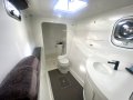 Chincogan 52 Designed by Tony Grainger, extensive refit 2018:Port side, master bathroom, with mini washing machine