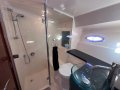 Mustang M43 Flybridge " IPS JOYSTICK DOCKING ":Complete bathroom view from front cabin door