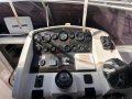 Mustang 3400 Wide Body " Bow Thruster and Generator ":Helm View of Dash