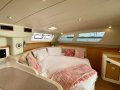 Leopard Catamarans 47 Robertson & Caine L47:Saloon table to bed conversion. Great day bed, passage bed, extra accomodation.