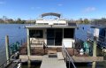 Historic two deck, stern paddle wheel houseboat