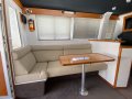 Randell 42 Flybridge " Repowered 30 knot Boat ":Port dinette and lounge