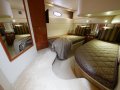 Silverton 43 Sport Bridge:Guest Cabin showing two single berths, can be converted into a queen with the insert