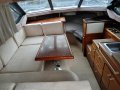 Bayliner 2556 Ciera Command Bridge:Table goes down and extra cushion on top for queen size bed