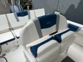 Robalo R230:Double flip up bolster helm chairs