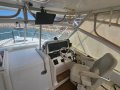 Luhrs 28 Open Tower Seakeeper and triaxle trailer