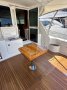 Riviera 47 Open Flybridge Series II - SOLD!:Riviera Teak Folding Cockpit Table - in closed position