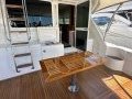 Riviera 47 Open Flybridge Series II - SOLD!:Riviera Teak Folding Cockpit Table - in open position