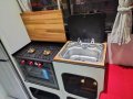 Trailerable Houseboat Custom Built:Cooktop and Sink uncovered