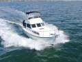 Northshore 37 Flybridge Cruiser Impressive Condition, Rare side boarding door