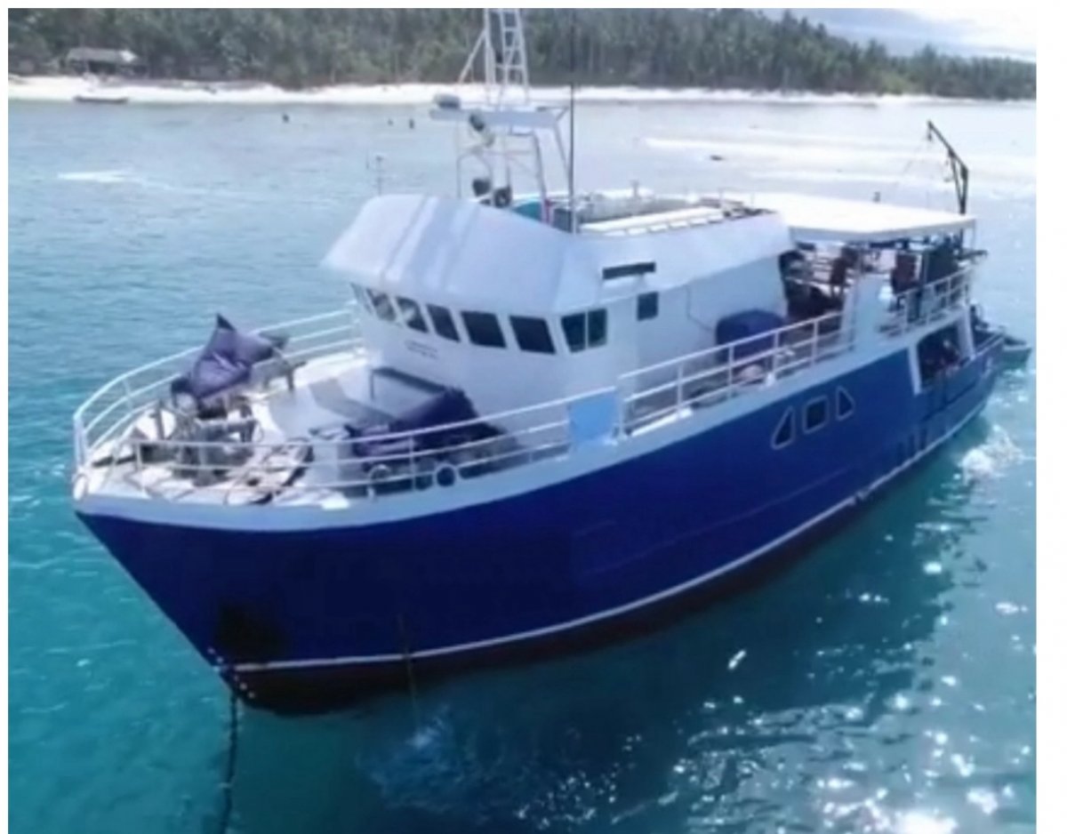 Trawler boat converted to a surf charter