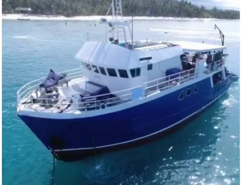 Trawler boat converted to a surf charter