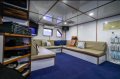 Trawler boat converted to a surf charter