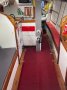 Adams 13 Aluminium with ballasted drop keel, ocean cruiser:Galley to port of keel case