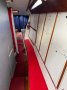 Adams 13 Aluminium with ballasted drop keel, ocean cruiser:Storage to starboard of keel case