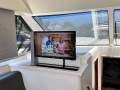 Riviera 3600 Sport Yacht "SHAFT DRIVES and BOW THRUSTER":Tv raised on Electric pedistal