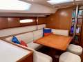 Beneteau Oceanis 50 - Luxury 3-cabin equipped for Offshore Cruising:Large dining table and footstools with centre storage