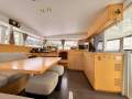 Lagoon 400 S2 2016 (Antifoul and polish 19/2/25 OoW survey free):Saloon and Galley. Table drops down to make a double bed, as does outside cockpit table.