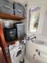 Leopard Catamarans 44:Forward Port Head as laundry with washing machine, icemaker and storage