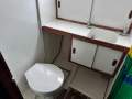 Northshore 37 Flybridge Cruiser " DIESEL SHAFT, BOW THRUSTER, DUAL HELMS ":Bathroom Vanity and Toilet