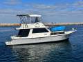 Northshore 37 Flybridge Cruiser " DIESEL SHAFT, BOW THRUSTER, DUAL HELMS ":NORTHSHORE 37 by YACHTS WEST