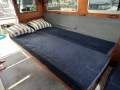 Northshore 37 Flybridge Cruiser " DIESEL SHAFT, BOW THRUSTER, DUAL HELMS ":Port lounge as Double bed