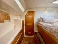 Perry 43 Sailing Catamaran Central elevated helm version:Stb fwd queen berth