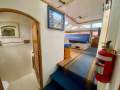 Perry 43 Sailing Catamaran Central elevated helm version:Port midships bathroom