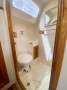 Perry 43 Sailing Catamaran Central elevated helm version:Port midships bathroom
