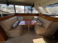 Mustang 43 Sportsfisher " VOLVO Pod drive IPS ":Port Lounge and Dinning table