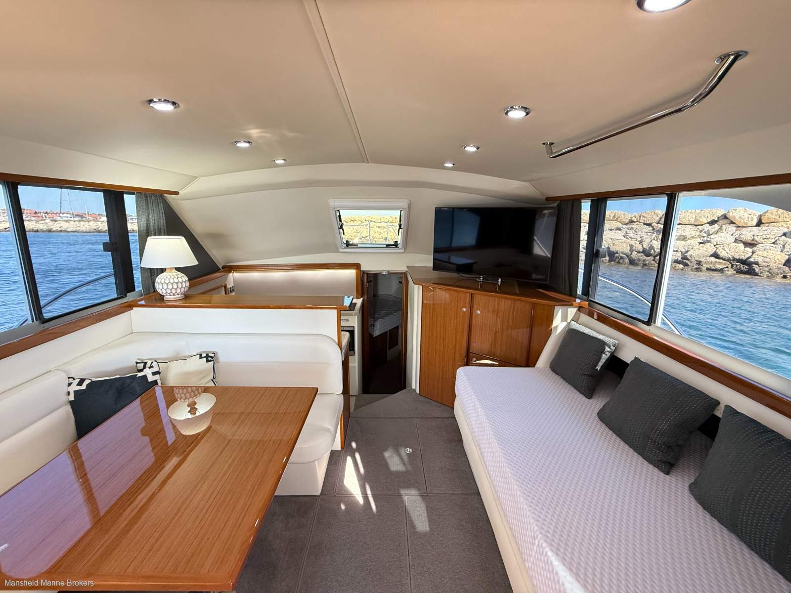 Caribbean 35 Flybridge Cruiser MK 3:STBD couch converted here