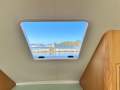 Mews 40 Flybridge Sports Fisher "Single Diesel Shaft with diesel genset ":Brow hatch for Ventilation and View
