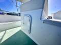 Mews 40 Flybridge Sports Fisher "Single Diesel Shaft with diesel genset ":Access hatch to Helm wiring