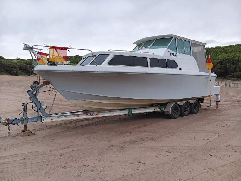 Swiftcraft V3000 Sapphire on a triaxle trailer.