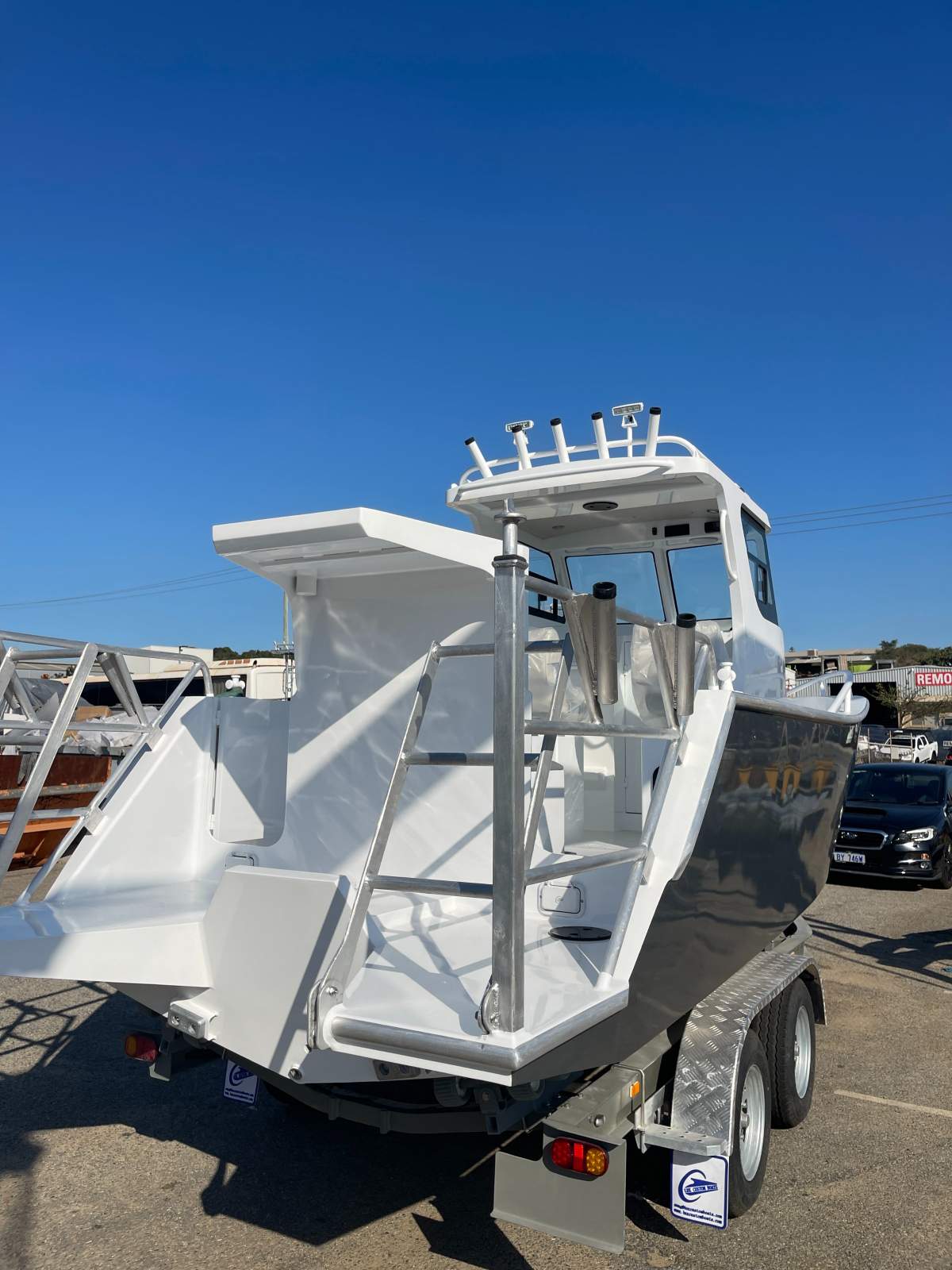 Lux Custom Boats 6100WA With added transom cage and double ladder