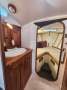 Adams 40CC:Bathroon/Head - Note more storage under the beds