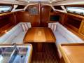 Bavaria Cruiser 35 - Repowered & Re-rigged 2022-New electrics 2019.:Large dining table with bottle storage in centrepiece