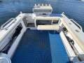 Quintrex 610 Trident Hardtop " BOATHOUSE STORAGE RACK available and TRAILER ":Huge Deck space and rear 3/4 seat
