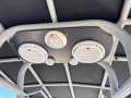Naiad 6.8 RIB " BOATHOUSE STORAGE RACK and TRAILER ":Speakers above helm