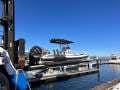 Naiad 6.8 RIB " BOATHOUSE STORAGE RACK and TRAILER ":Being loaded into water
