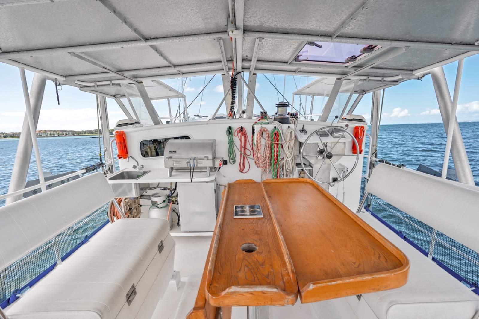 Diesel Duck Classic 44:Aft covered deck; windscreens slide up for nice weather