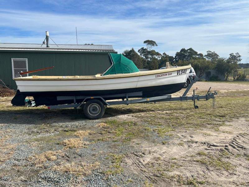 Custom fibreglass fishing boat on trailer